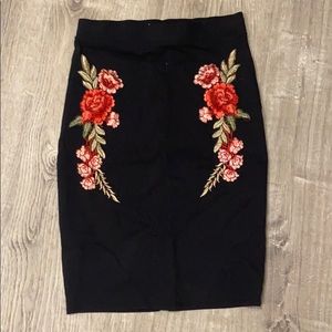 Above the need rose black skirt